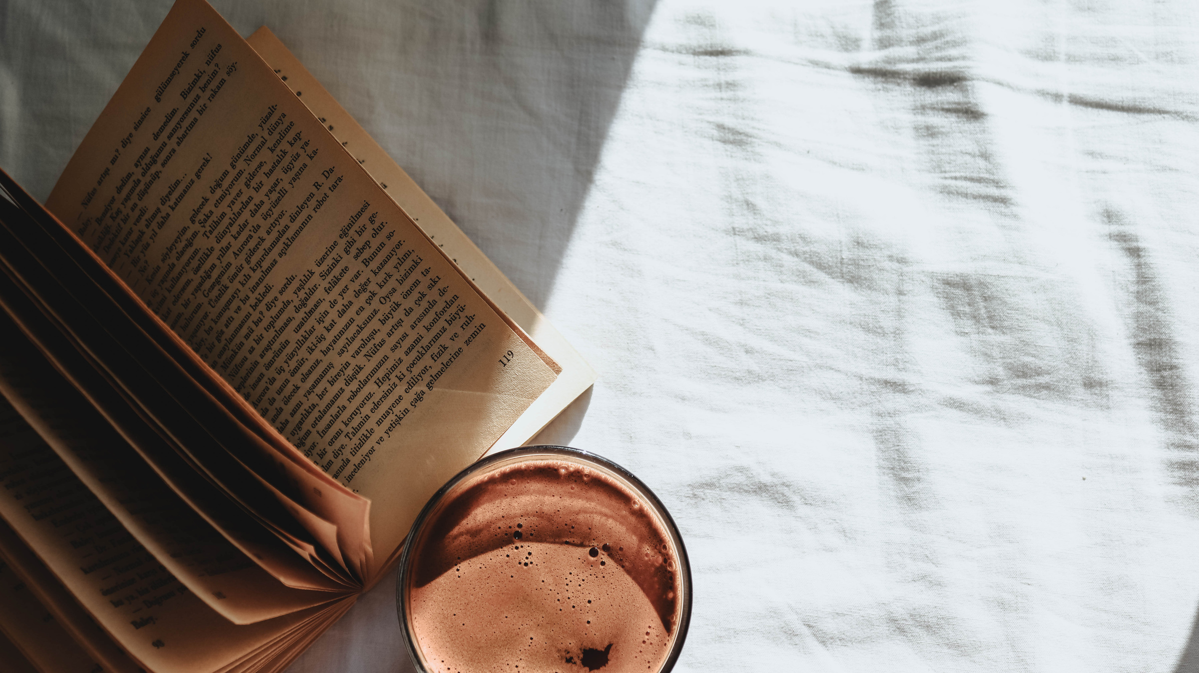 Book with Yellowing Pages and a Coffee in Bed 